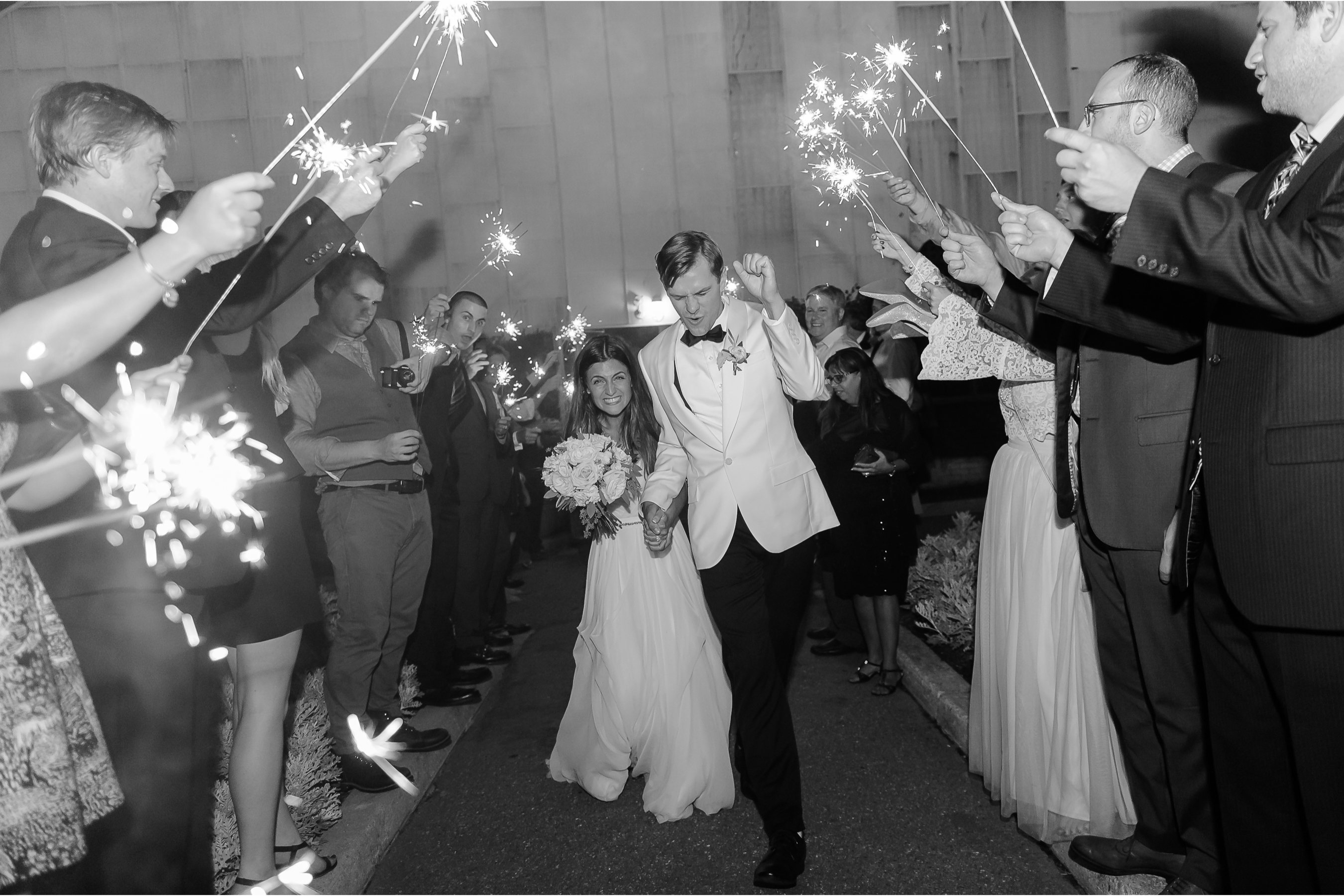 The bride and groom say good bye to their wedding guest with a sparkler send off on their wedding day in Philly.